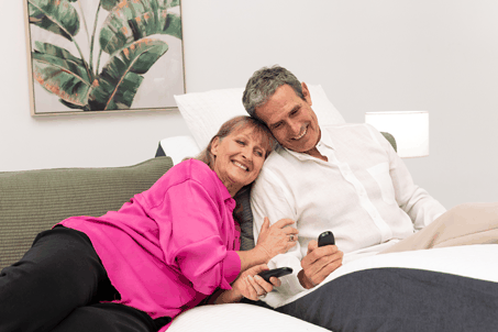 Couple laying on Split Queen Sophie Adjustable Bed