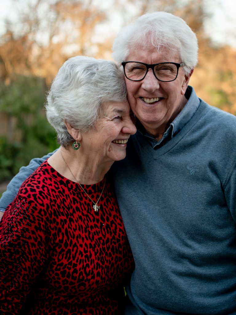 seniors hugging after sleeping in an adjustable bed